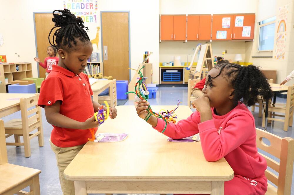 Two students playing in the classroom