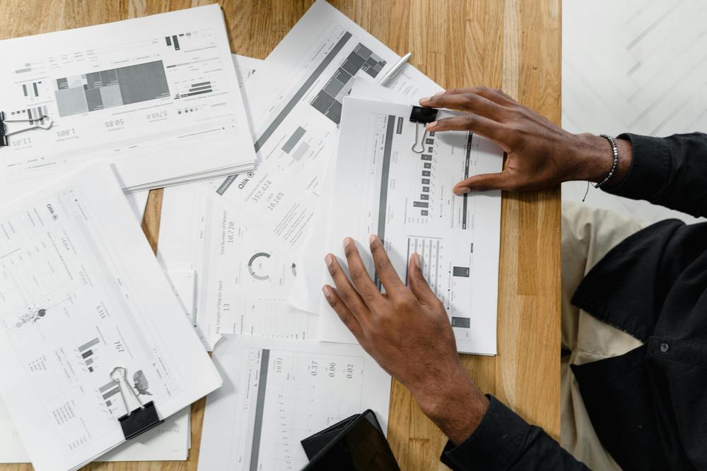 person reading charts and documents