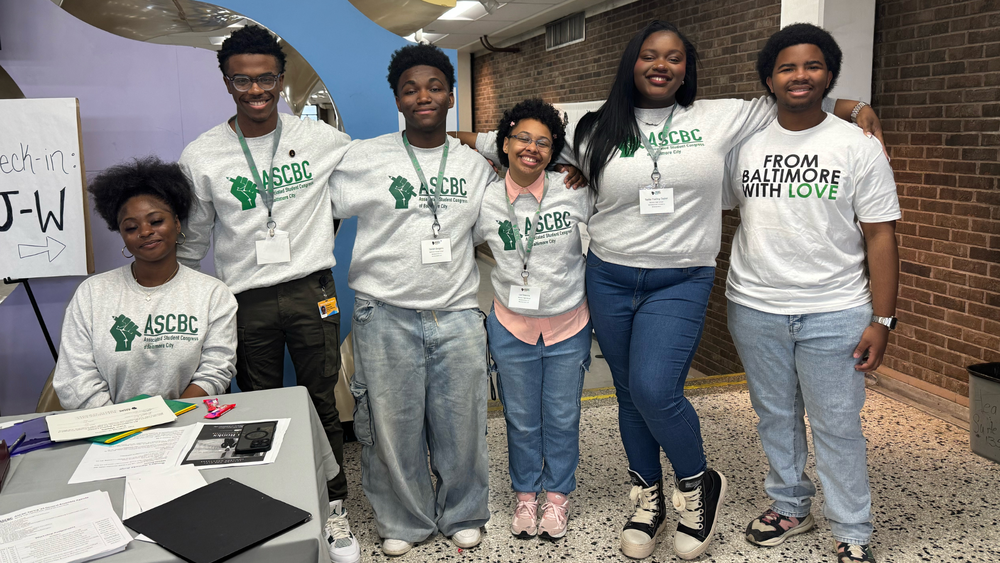 A photo of ASCBC students posing together in ASCBC sweaters