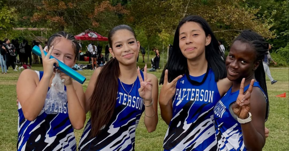 Four cross country student-athletes from Patterson High School 