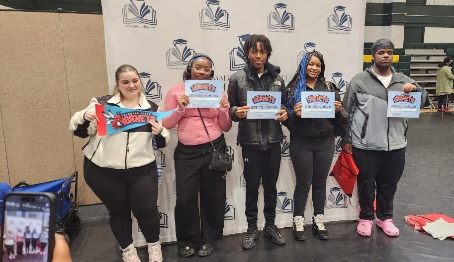 Students holding a certificate
