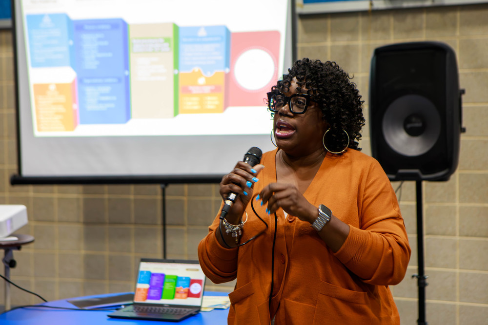 Staff presenting to a crowd of parents