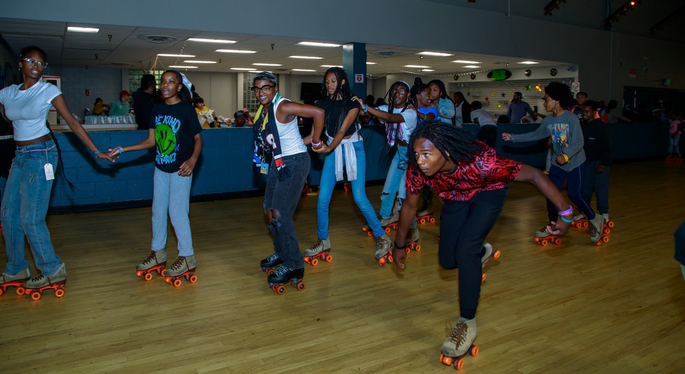 Teenagers skating on a skating rink