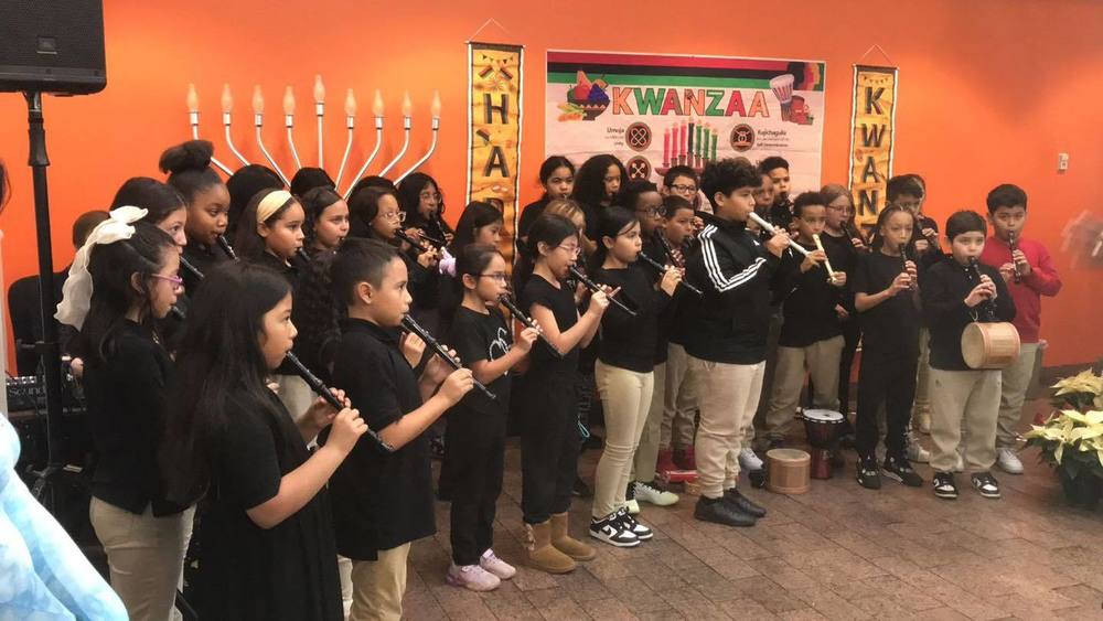 Armistead Gardens students perform at the district office.