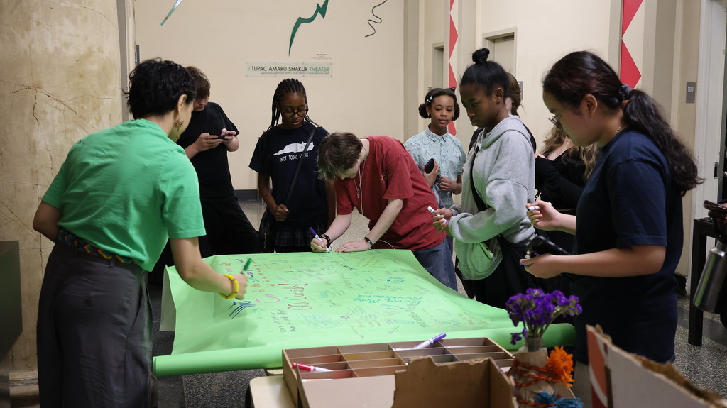 BSA student writes what she is grateful for on the group board.