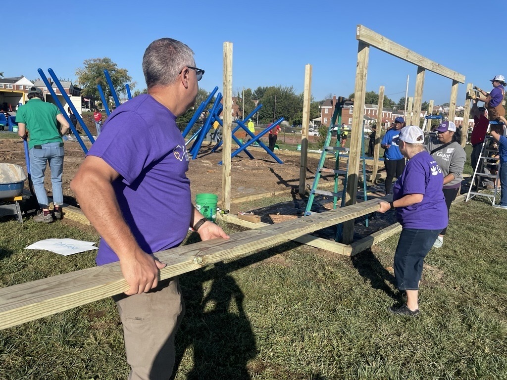 Volunteers helps put together a new playground at Sinclair Elementary. 