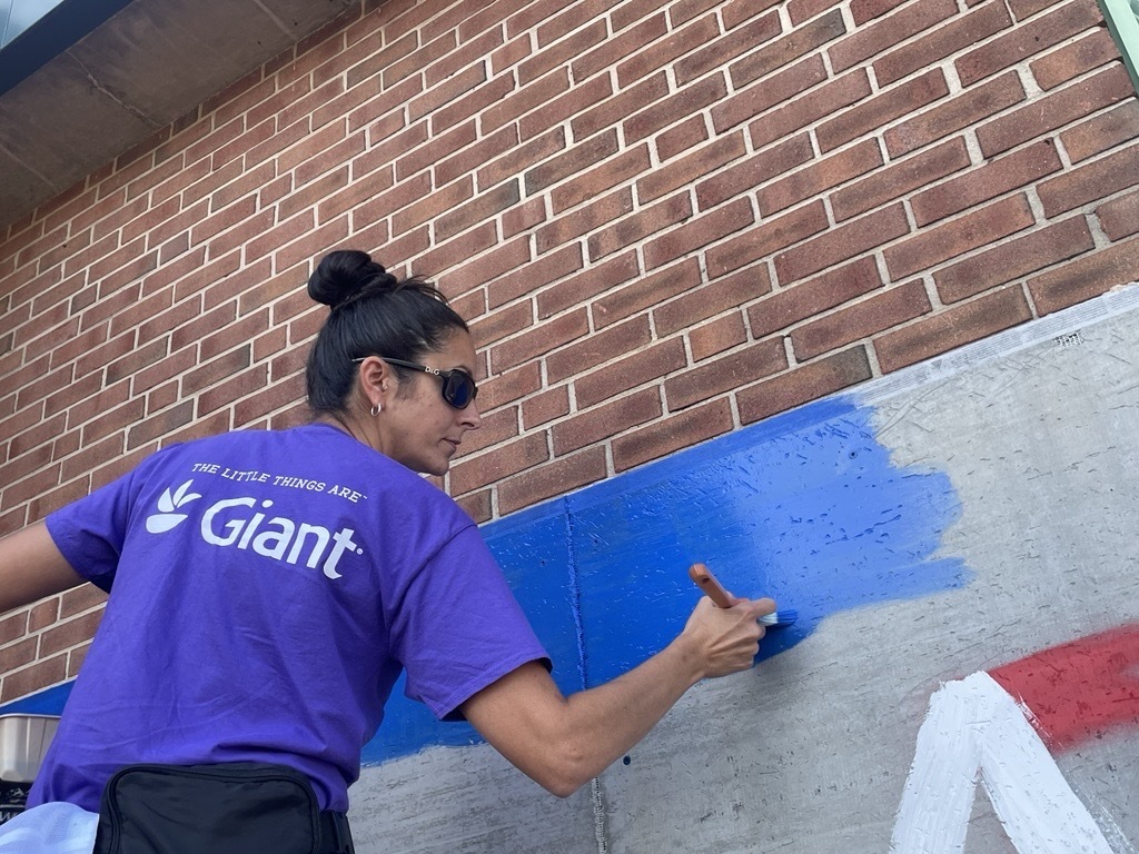 Volunteers helps put together a new playground at Sinclair Elementary. 