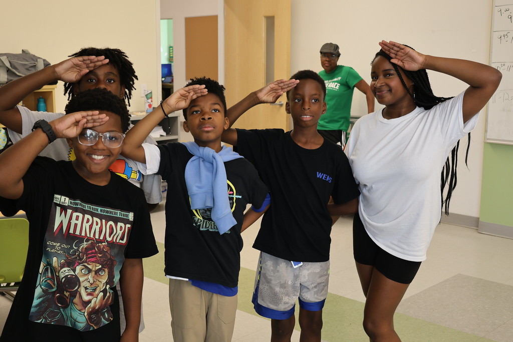 Fine Arts Camp Students hold their final pose after performing a spoken word piece. 