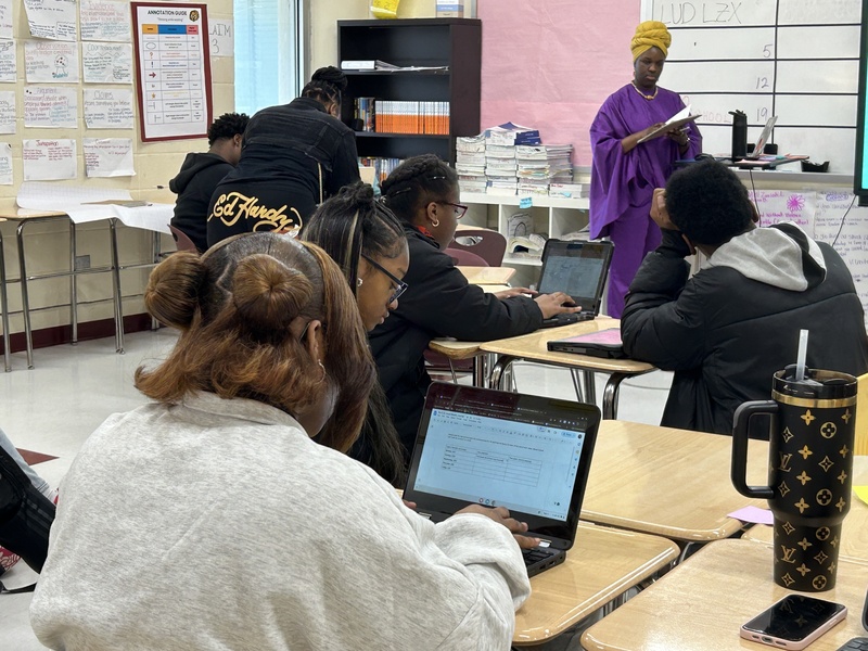 Student on a laptop in a classroom
