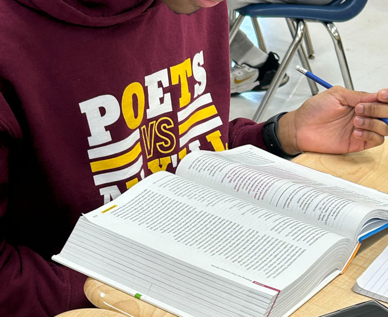 one student reading a book