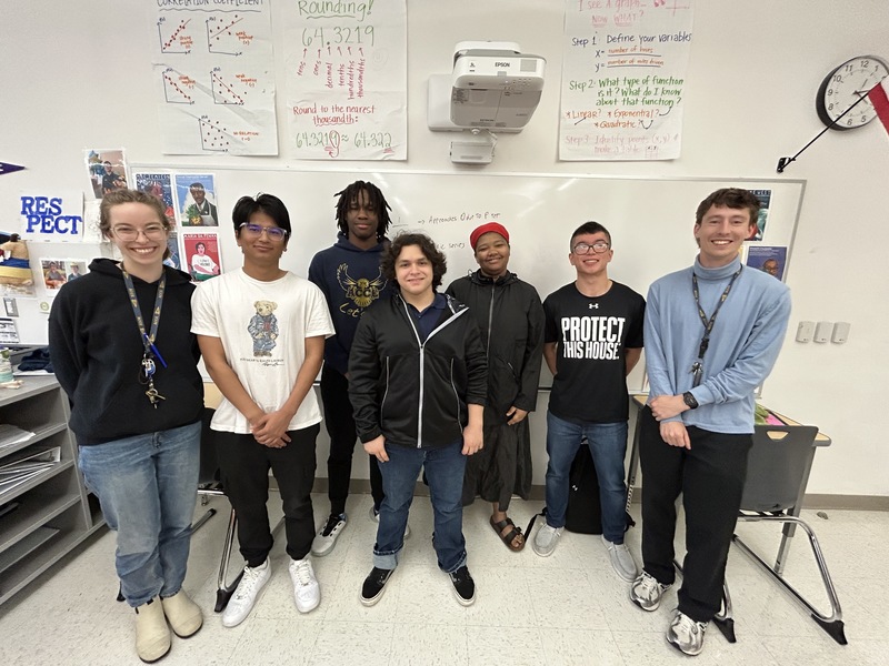 Our AP course connoisseurs line up for a photo against a classroom whiteboard (from left to right): Jennifer DeJong, Sudarshan, Jordan, Oscar, Audrey, Jevons Liu, Peder Delia 