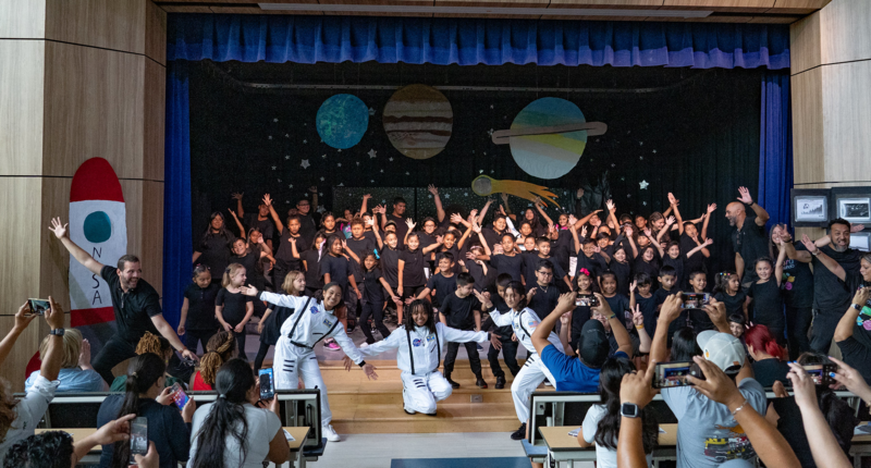 Spanish Theater Camp students pose for a photo on the stage for their final performance of the summer. 