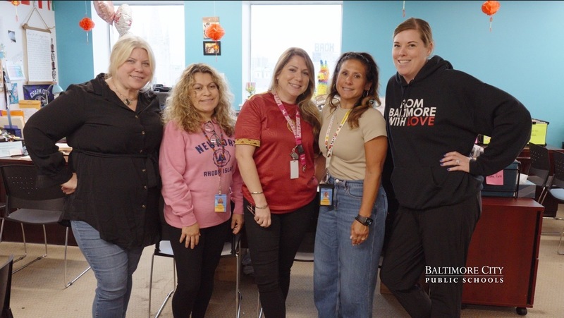 Offic eof Multilingual Learning staff poses for a group photo. 