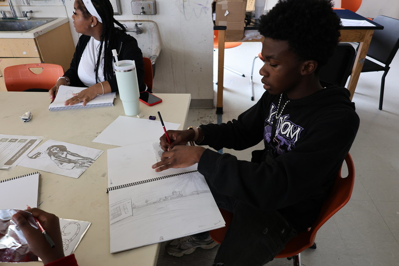 Tequari, a rising 9th grader at Dunbar High School, added to his prolific drawing portfolio.