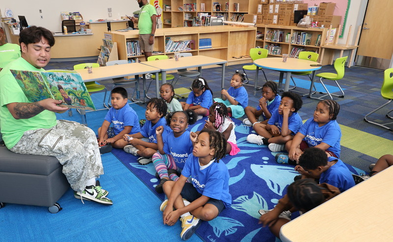 Billie Holiday springboard students enjoy read aloud time in the library. 