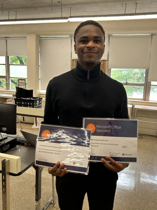 Genesis Cruikshank hold up multiple certificates