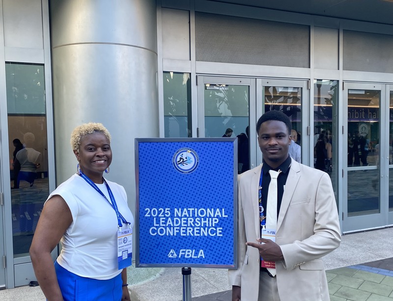 Genesis and Ms. Moore pose for a picture at National Leadership Conference