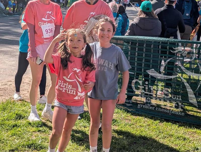 Schoolgirls run as part of the "Girls on the run" program.