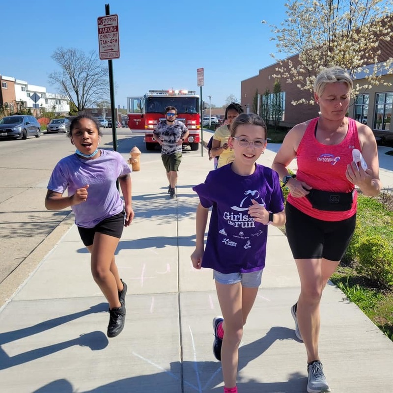 Schoolgirls run as part of the "Girls on the run" program.