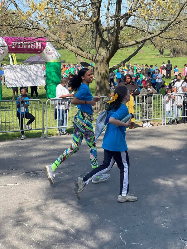 Schoolgirls run as part of the "Girls on the run" program.