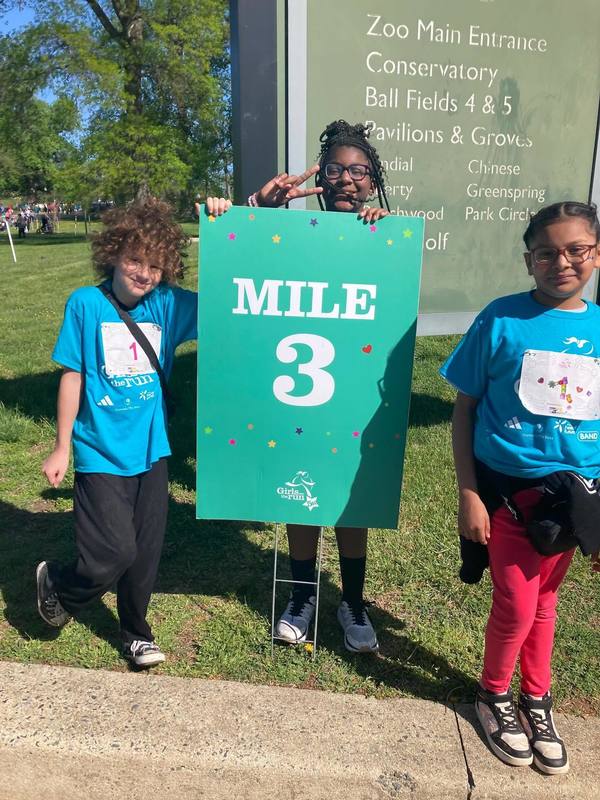 Schoolgirls run as part of the "Girls on the run" program.