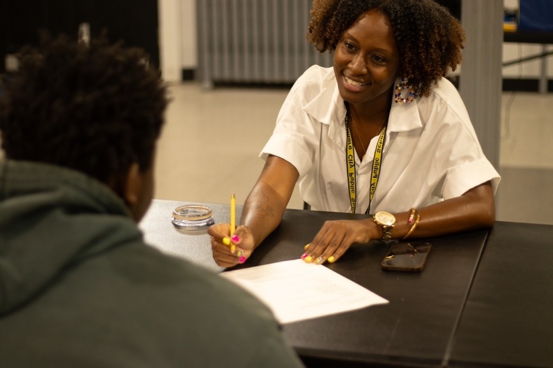 Tanipa Thomas mentors students during session at Booker T.  Washington