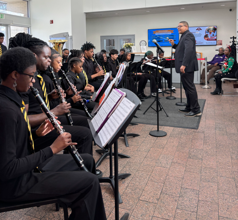 Mr. Robinson and the band performing at the Central Office