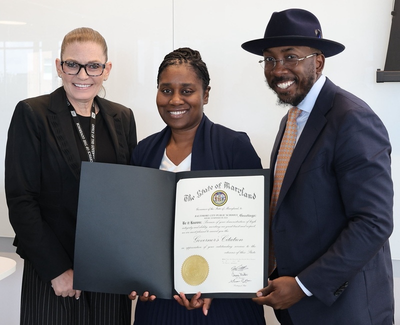 Maria Martinez, Dr. Lynette Washington and Commissioner Muhammad pose with  Governor’s Citation