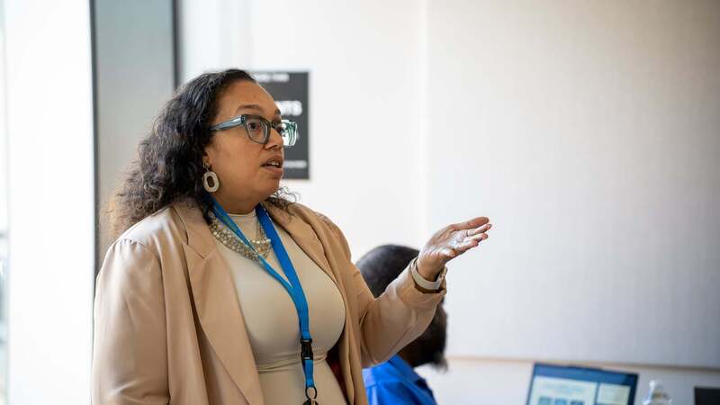 Chanel Franze speaks to the MWBE crowd