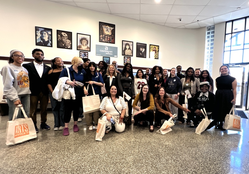 A group of students, adults, and Mayor Scott at the Courting Art reception