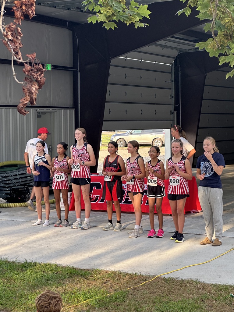 Barrett and Cali receiving medals. 