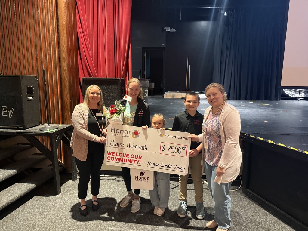 claire hemsath holding scholarship check 2