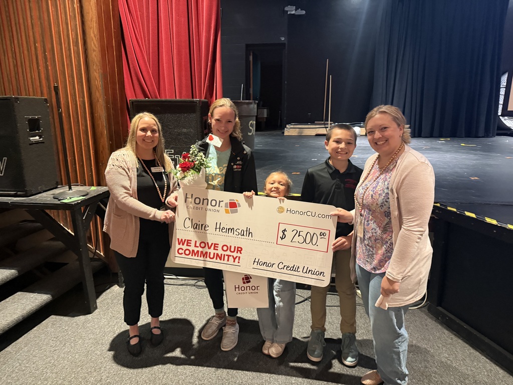 claire hemsath holding scholarship check 1