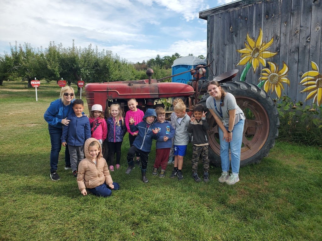 Recently Vine Street Pre-K Students took a field trip to Country Pumpkins and Kindergarten students spent a beautiful fall morning at Conant's Apple Orchard.  The class took a tractor ride out to the apple orchard and learned all about the life cycle of an apple and the correct way to pick an apple.  They also learned about the importance of bees and pollination to the apple crop.  Back in our classrooms, we did lots of activities connected to our field trip.  The students created apple volcanoes, apple crafts, apple graphs, and even apple nachos!