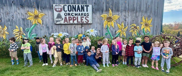 Recently Vine Street Pre-K Students took a field trip to Country Pumpkins and Kindergarten students spent a beautiful fall morning at Conant's Apple Orchard.  The class took a tractor ride out to the apple orchard and learned all about the life cycle of an apple and the correct way to pick an apple.  They also learned about the importance of bees and pollination to the apple crop.  Back in our classrooms, we did lots of activities connected to our field trip.  The students created apple volcanoes, apple crafts, apple graphs, and even apple nachos!