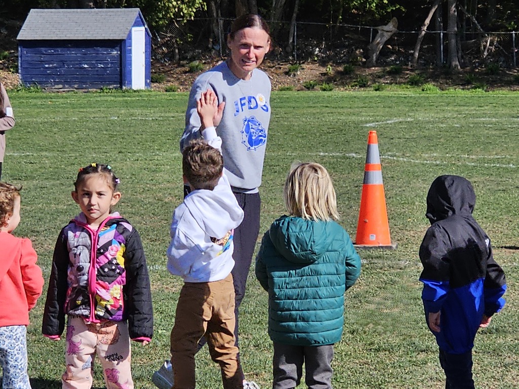 seventh and eighth graders from the James F. Doughty School gathered on the middle school's soccer field to volunteer as coaches for the Vine Street Pre-K students