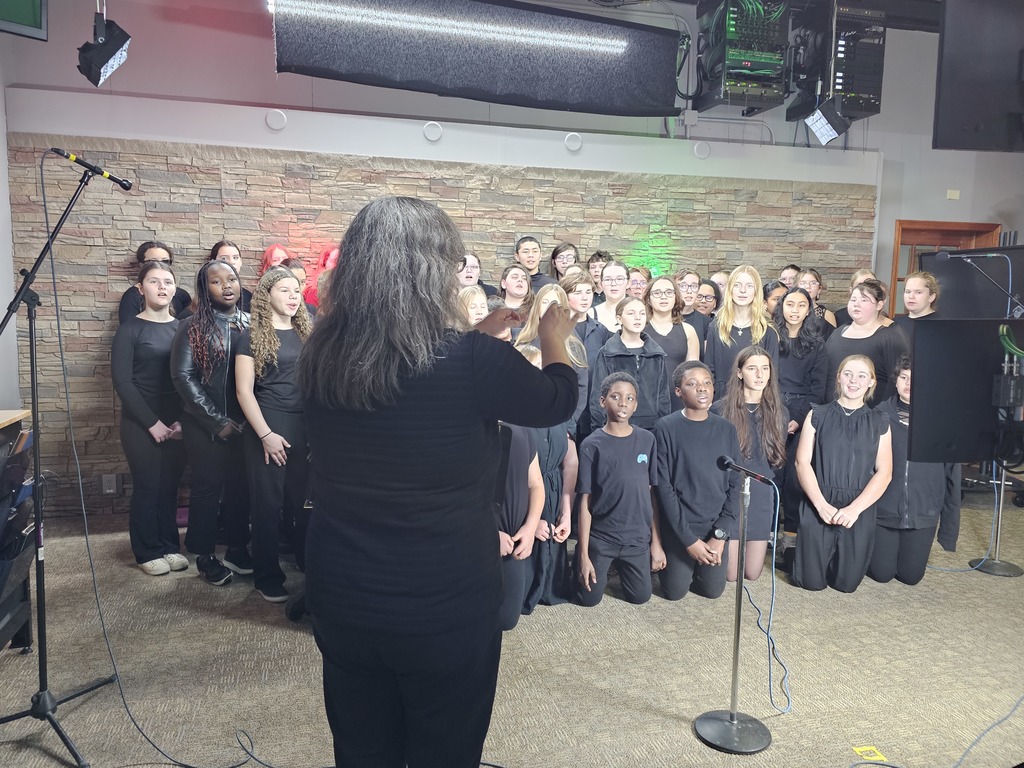 Mrs. Holsapple directing middle school choir