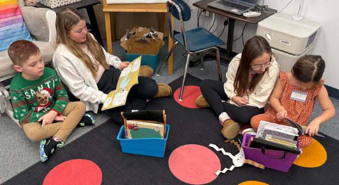 Fifth-grade students from Mary Snow School arrived at Fruit Street to spend time working with our Pre-K, kindergarten, and first-grade students. Together, the students collaborated to create a snowman, sharing ideas and teamwork throughout the activity. Afterward, they enjoyed time reading a story together, building connections and fostering a love of learning across grade levels.