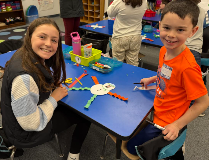 Fifth-grade students from Mary Snow School arrived at Fruit Street to spend time working with our Pre-K, kindergarten, and first-grade students. Together, the students collaborated to create a snowman, sharing ideas and teamwork throughout the activity. Afterward, they enjoyed time reading a story together, building connections and fostering a love of learning across grade levels.