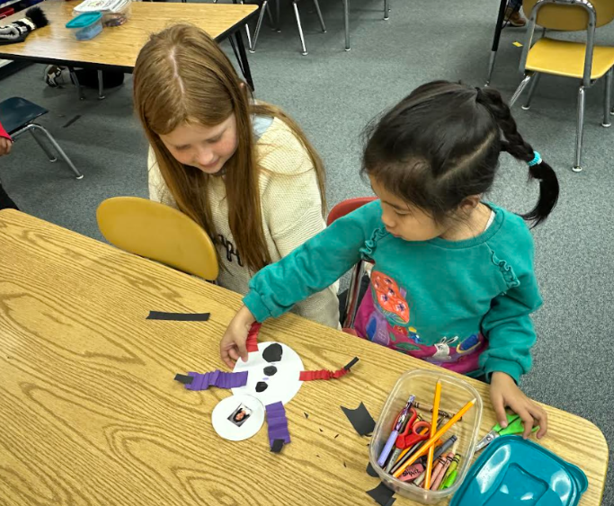 Fifth-grade students from Mary Snow School arrived at Fruit Street to spend time working with our Pre-K, kindergarten, and first-grade students. Together, the students collaborated to create a snowman, sharing ideas and teamwork throughout the activity. Afterward, they enjoyed time reading a story together, building connections and fostering a love of learning across grade levels.