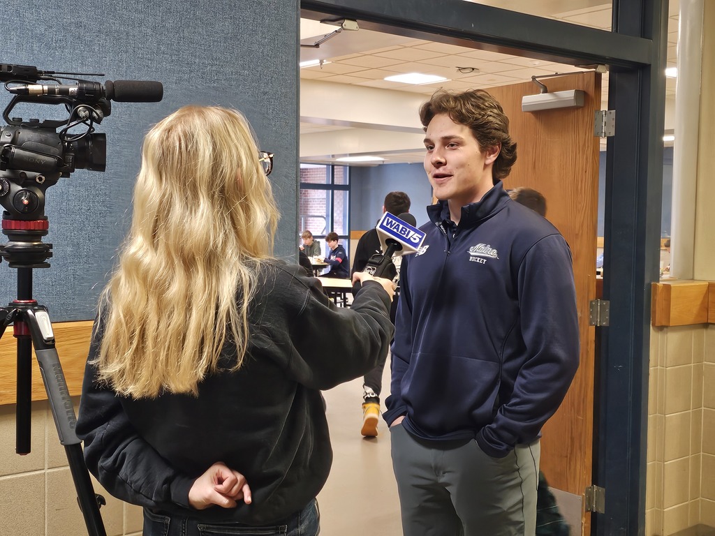 UMaine Hockey Player Charlie Russell speaking to WABI TV at JFDS