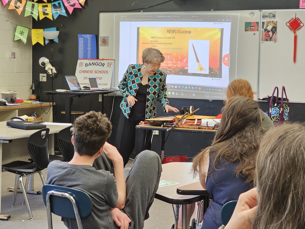 On Wednesday, Doughty students participated in a multicultural day featuring presentations from all over the world. Students traveled to different countries (classrooms) to learn about diverse cultures. Throughout the morning groups visited places like Nigeria, Uzbekistan, Bulgaria, Spain, China, and Lebanon. These presentations were run by people in the Bangor-area community, including multilingual students and teachers from Bangor High School, members of Chispa, the Bangor Chinese School, the Maine Multicultural Center, the University of Maine, and Blackbird Beats from the Children’s Museum and Theater of Maine.