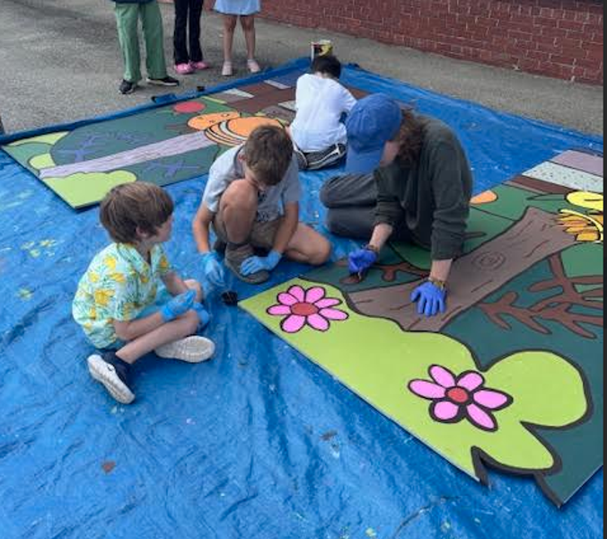 The new Fruit Street mural is a colorful and whimsical celebration of nature, pollinators, and the fruit trees that help our ecosystem thrive. This project was truly a community effort. Each Fruit Street student learned about the important role pollinators play and created the artwork that inspired the mural's design. Over the past week, students rolled up their sleeves and helped paint the mural alongside Bangor High School art students, teachers, and volunteers. A special thank you to Bangor Beautiful and Maine artist Peter Walls, who brought all of the student-created elements together into one beautiful final design. This weekend, Peter, his son, Bangor Beautiful volunteers, and Principal Fournier completed the installation, giving the school a lasting piece of art that reflects creativity, learning, and community pride. Be sure to stop by and admire this vibrant new addition to Fruit Street!
