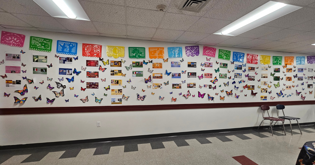 Students in Bangor High School Spanish classes recently explored the rich traditions of Hispanic Heritage Month through a unique study of the Mariposa Monarca (Monarch Butterfly). Students researched how millions of monarch butterflies migrate from the United States and Canada to central Mexico each year and learned about their special connection to Día de los Muertos. In many Mexican communities, the arrival of the monarch butterflies coincides with the holiday and is seen as a symbol of remembrance and connection to loved ones who have passed away. The vibrant hallway display features student-created butterflies and research projects representing Spanish-speaking countries and cultures across the Americas. This colorful exhibit celebrates language, culture, history, and the incredible journey of the monarch butterfly. #WeAreBangor #HispanicHeritageMonth #WorldLanguages