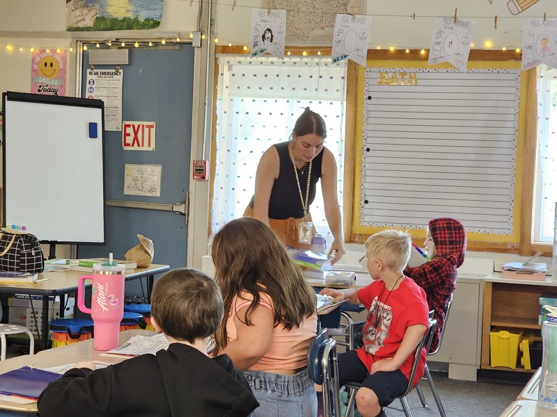 3rd Grade Teacher at Downeast School interacting with students in the classroom.