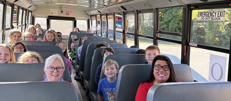 Dr. Quirk with Fairmount students during a recent bus safety drill.