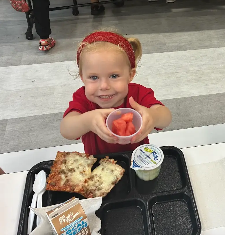 Child with watermelon serving