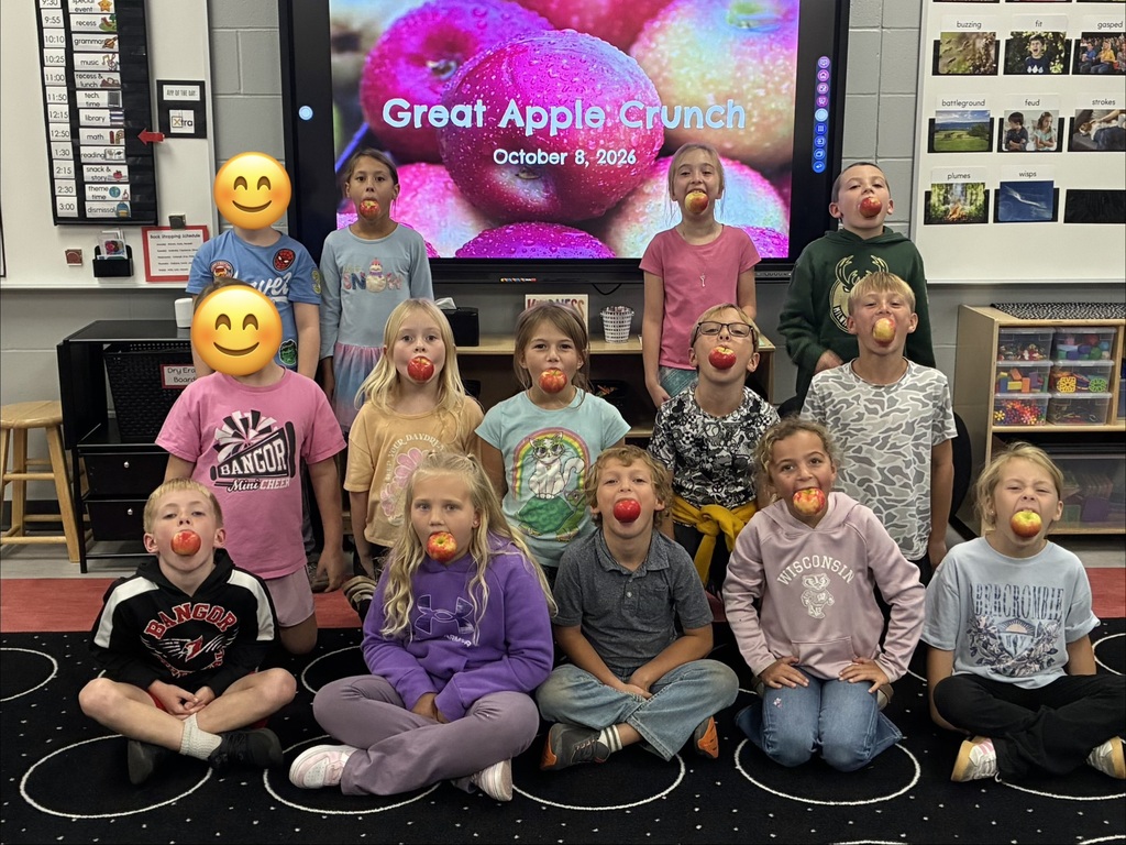 Students enjoying fresh apples.
