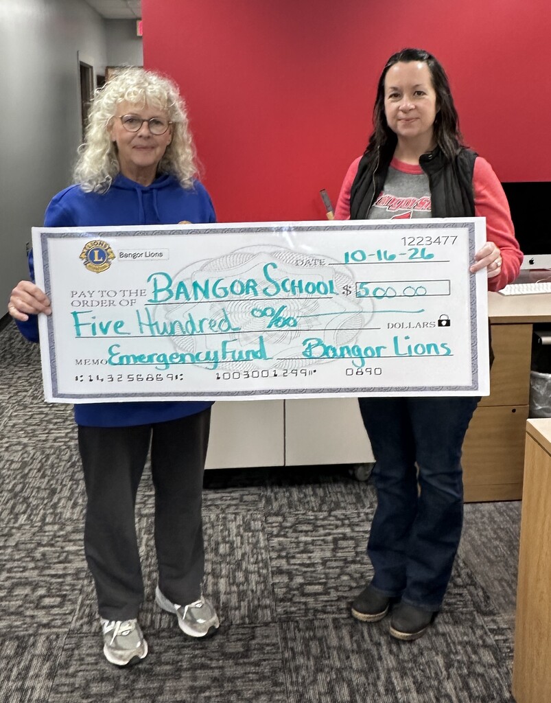 Bangor Lions representative presenting check for Emergency Fund