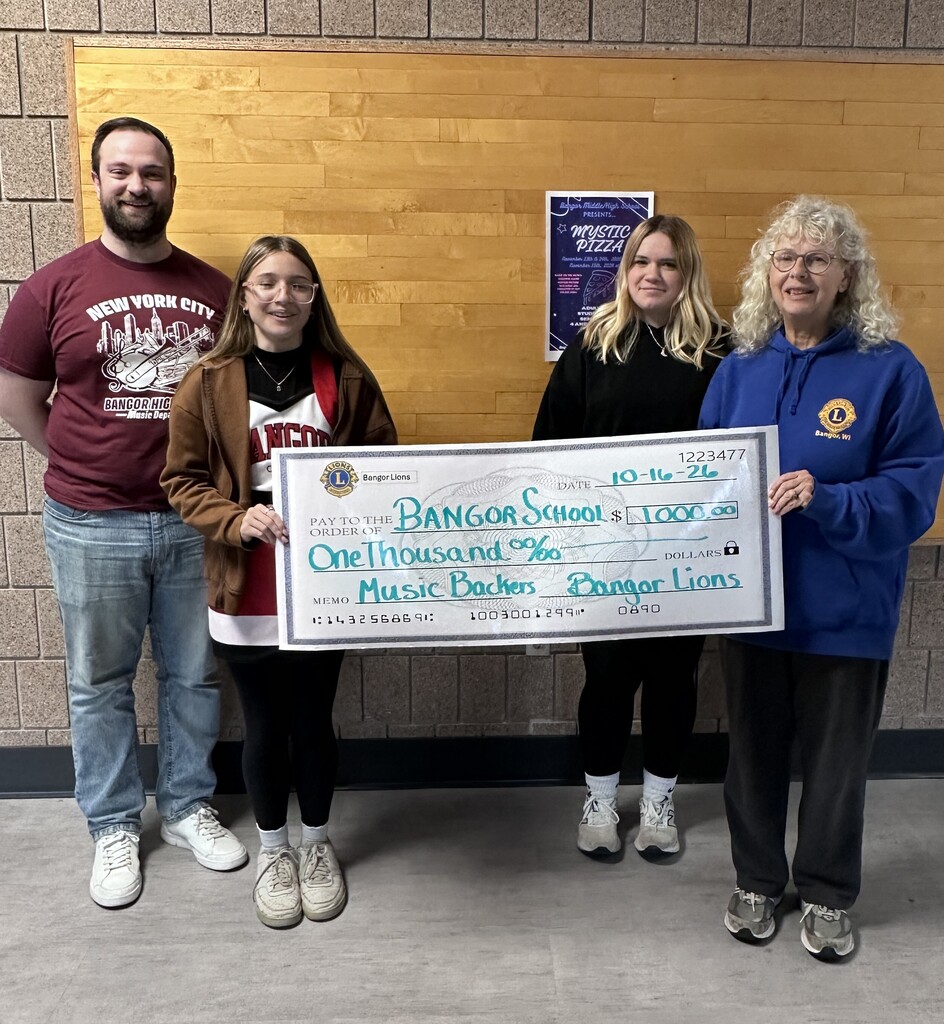 Bangor Lions representative presenting check to Music Backers